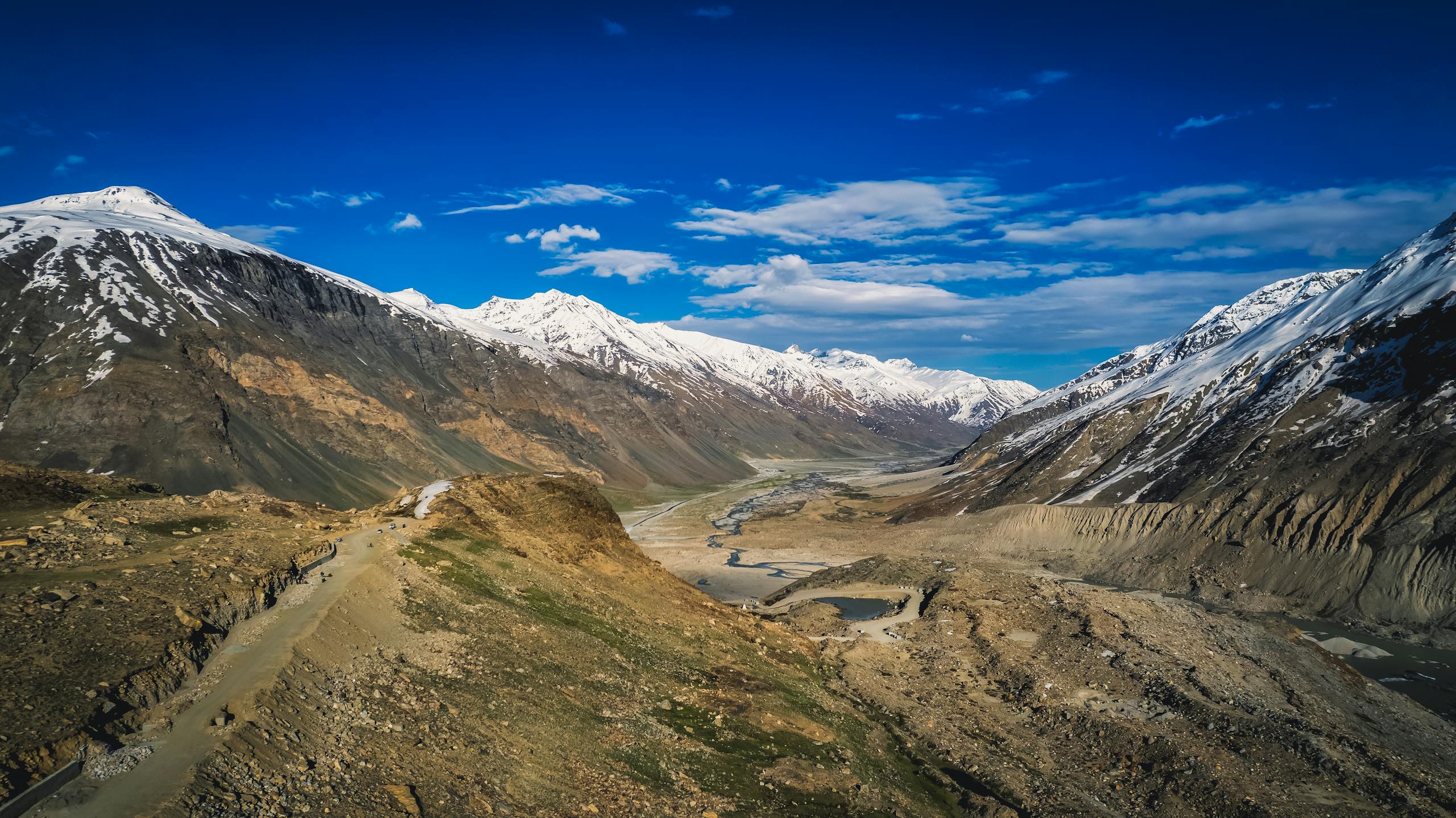 Stunning view of the snow-capped Himalayas in Zanskar with clear blue skies.